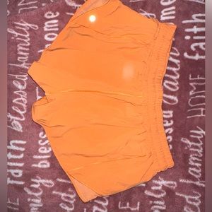 LULULEMON SIZE 10 2.5” HOTTY HOT SHORTS COLOR HIGHLIGHTER ORANGE